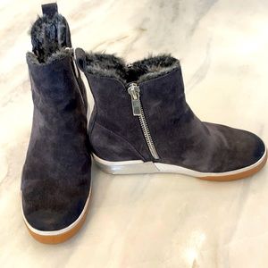 Dolce Vita fur lined suede hightop rubber soles shoe with silver accents.